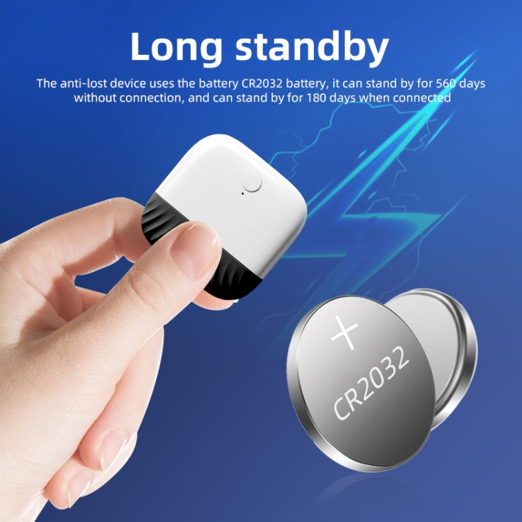 Two-way Bluetooth anti-lost key finder with circular CR2032 battery holder, handheld close-up