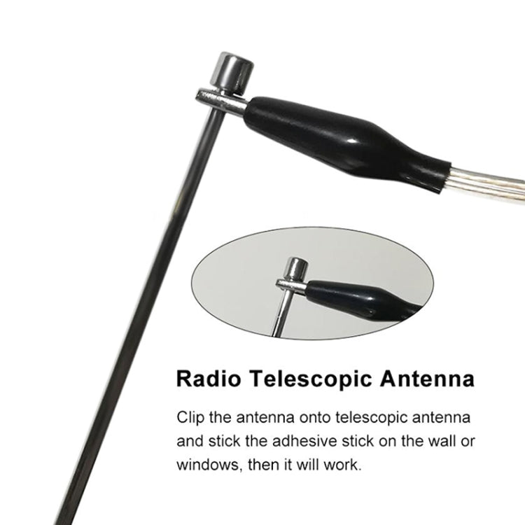 Radio boost antenna with black stem, metal base, and wire alligator-clip connector
