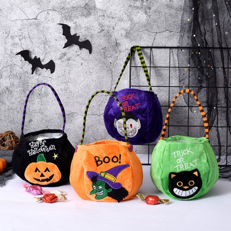 Set of Halloween candy cloth bags: black, orange, and green with festive graphics