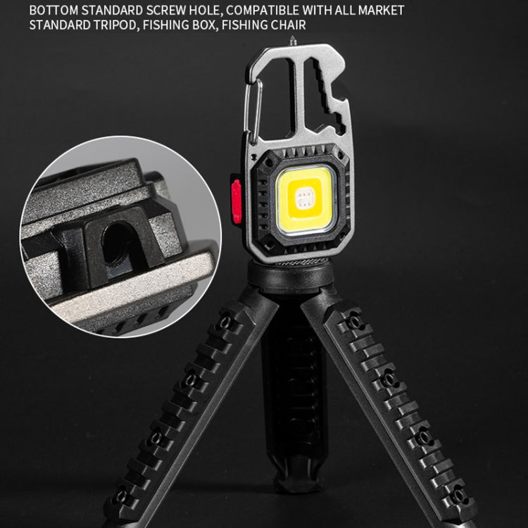 Mini portable flashlight on tripod stand with yellow front light and adjustable legs