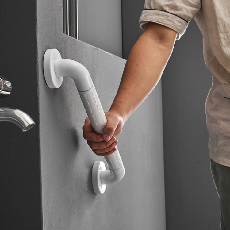 White anti-slip bathroom handrail mounted on wall, curved handles for grip
