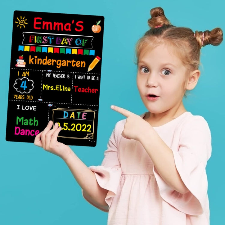 Black hanging message board held by child with First Day of kindergarten and Date