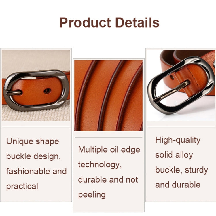 Leather belt detail showing oval silver buckle and oil-finished edge
