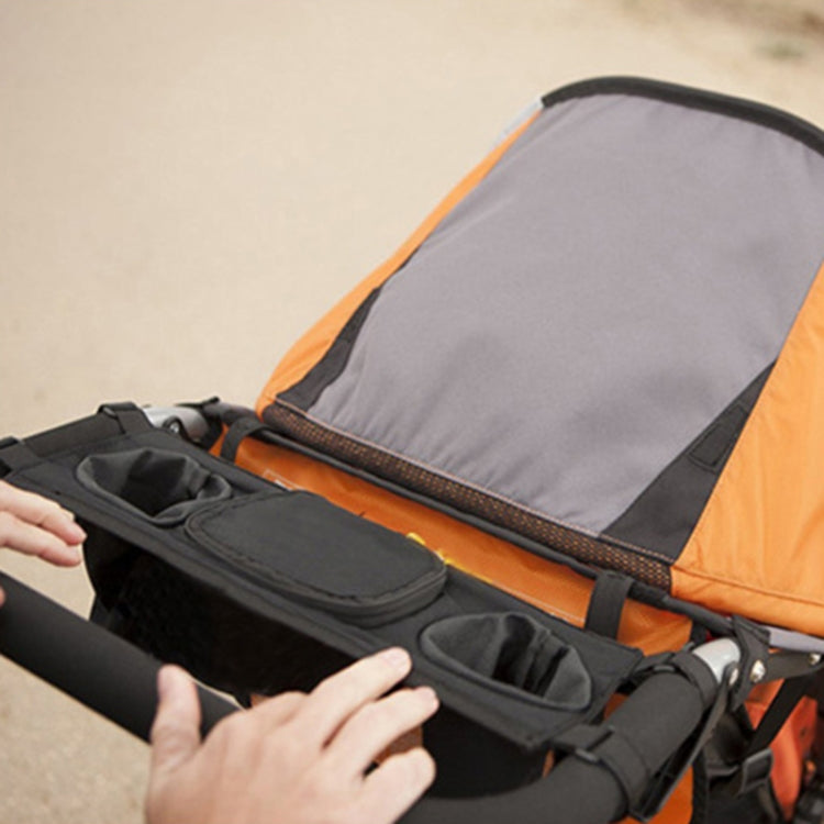 Orange stroller frame with black organizer pockets and secure attachment straps