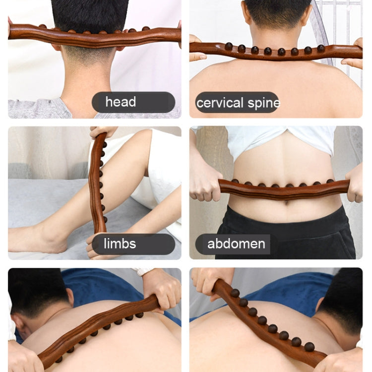 Carbonized beech wood massage stick with bead row, shown being used on skin