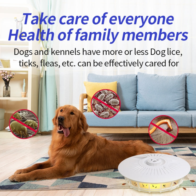 Pearl white round indoor insect trap lamp placed on the floor near a dog