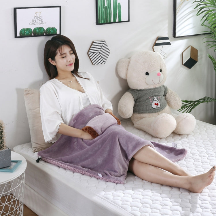 Lilac fleece electric blanket, knee warmer style laid across seated legs