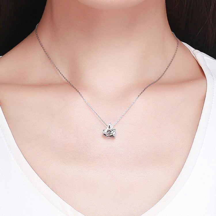Silver-tone charm bracelet with small letter zircon-style pendant on chain