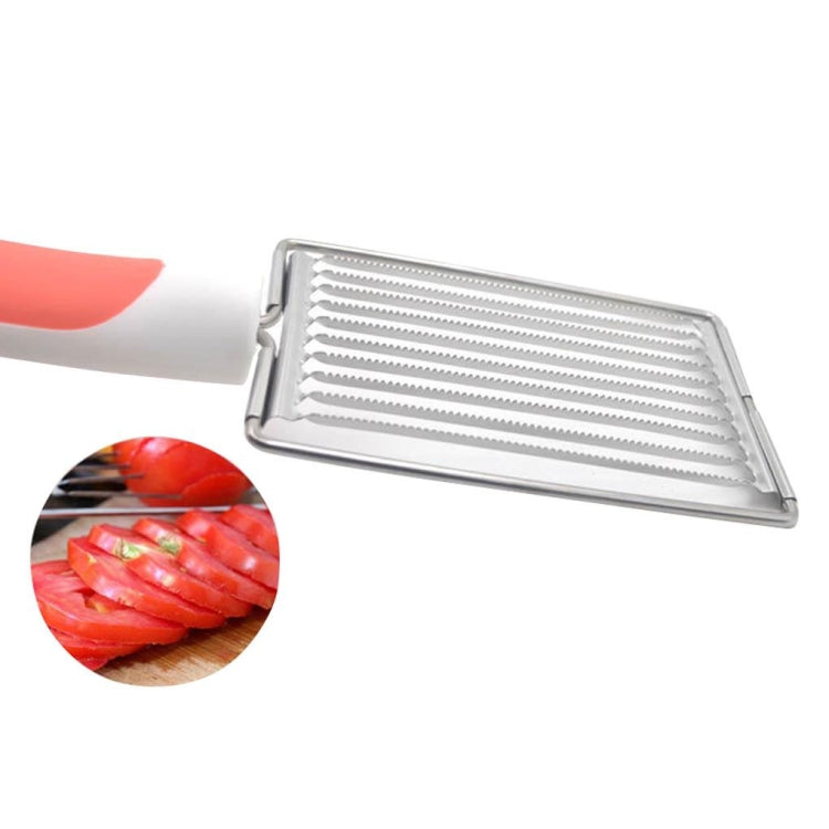 Stainless steel slicing tray with serrated blade rows and orange-red handle