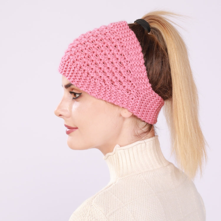 Knitted wide headband with ear coverage, pink, worn with a ponytail