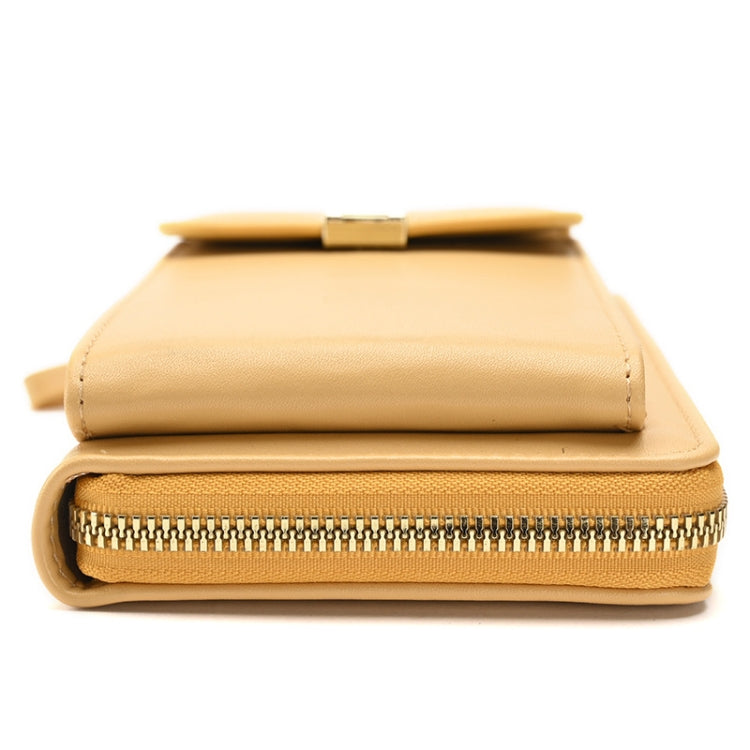 Tan cross-body wallet bag with snap flap and zip closure, compact design