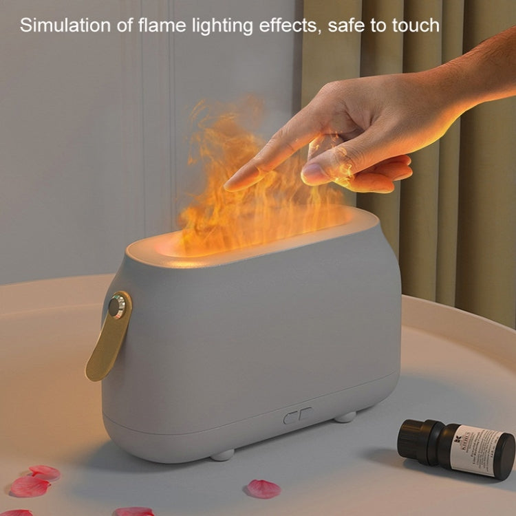 White flame-effect humidifier with hand near flame-like light, safe-touch design