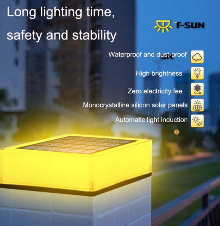 Outdoor solar deck light with square solar panel, bright yellow illumination, white base