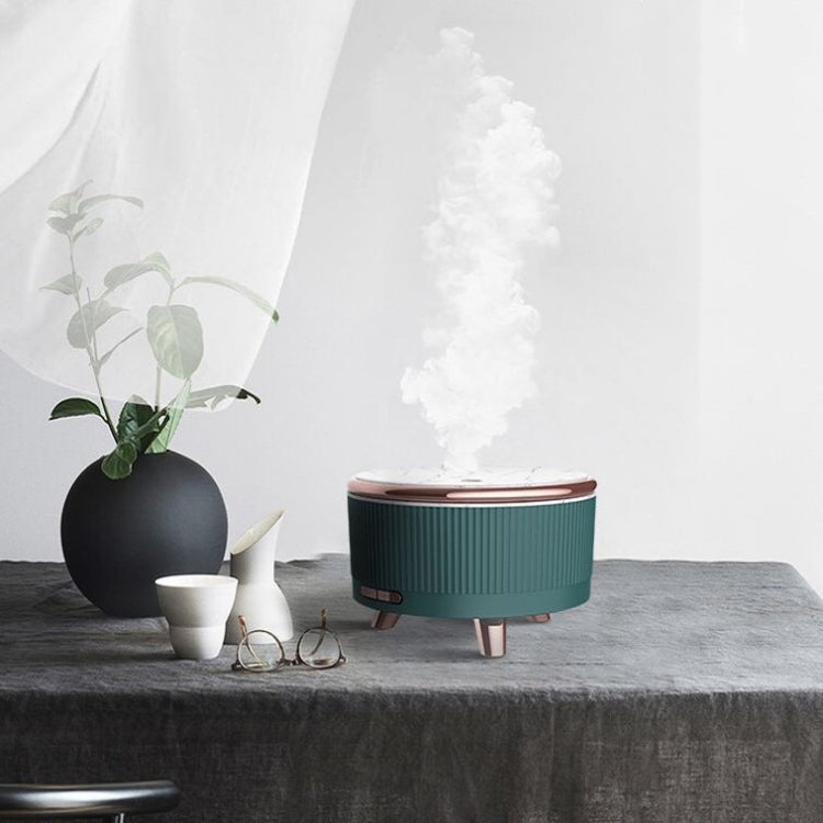 Teal ultrasonic aroma diffuser humidifier on dark tabletop, tall vapor cloud