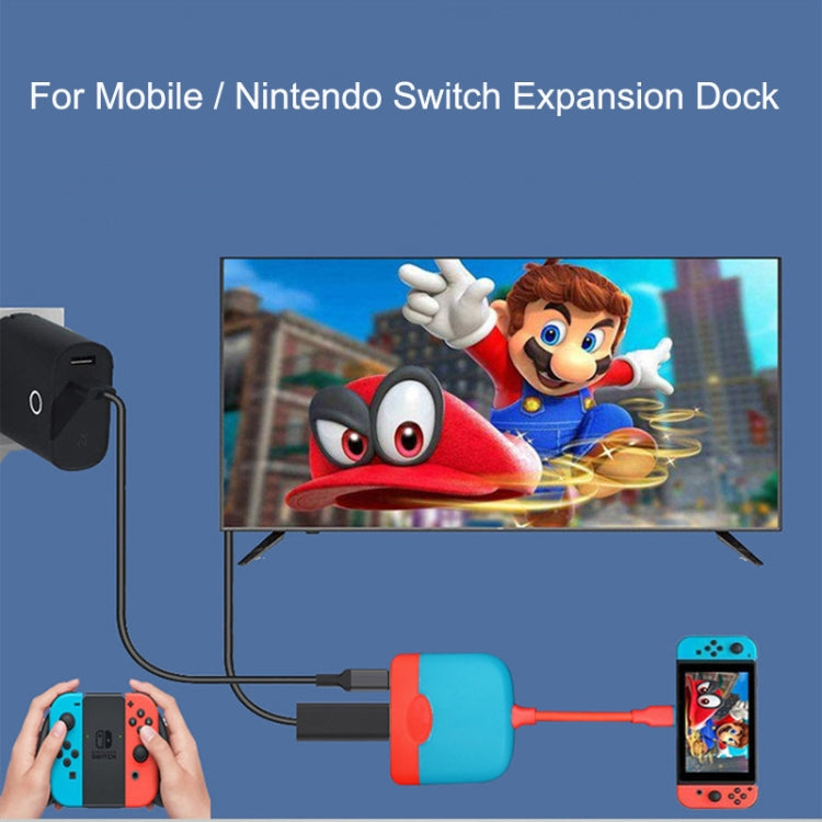 Portable expansion dock setup with connected phone and Nintendo Switch-style display via cables