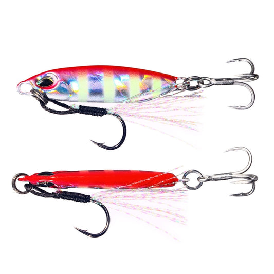 Pair of double-hook shore casting lures in silver-blue and red with spinning tail strands