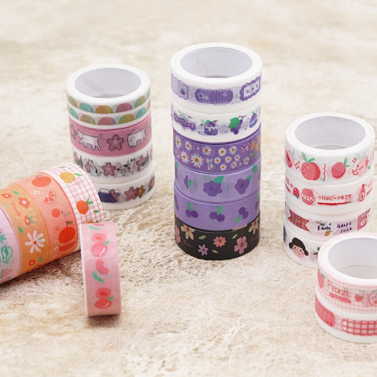 Assorted cartoon-pattern washi tape rolls and a loose tape strip