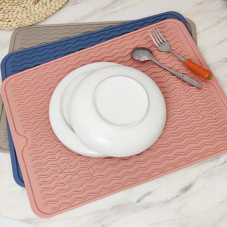 Wave-pattern thermal anti-slip mat, khaki pink top with blue backing, rounded corners