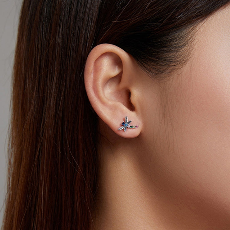 925 silver insect crystal stud earrings on ear with blue and pink stones