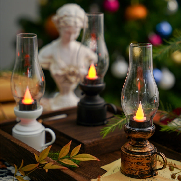 Bronze retro kerosene-style oil lamp with glass chimney and burning wick flame