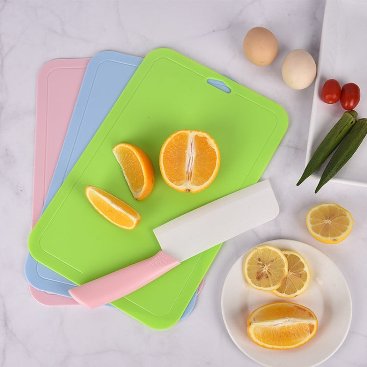 Pastel plastic cutting boards with hanging holes for fruit prep