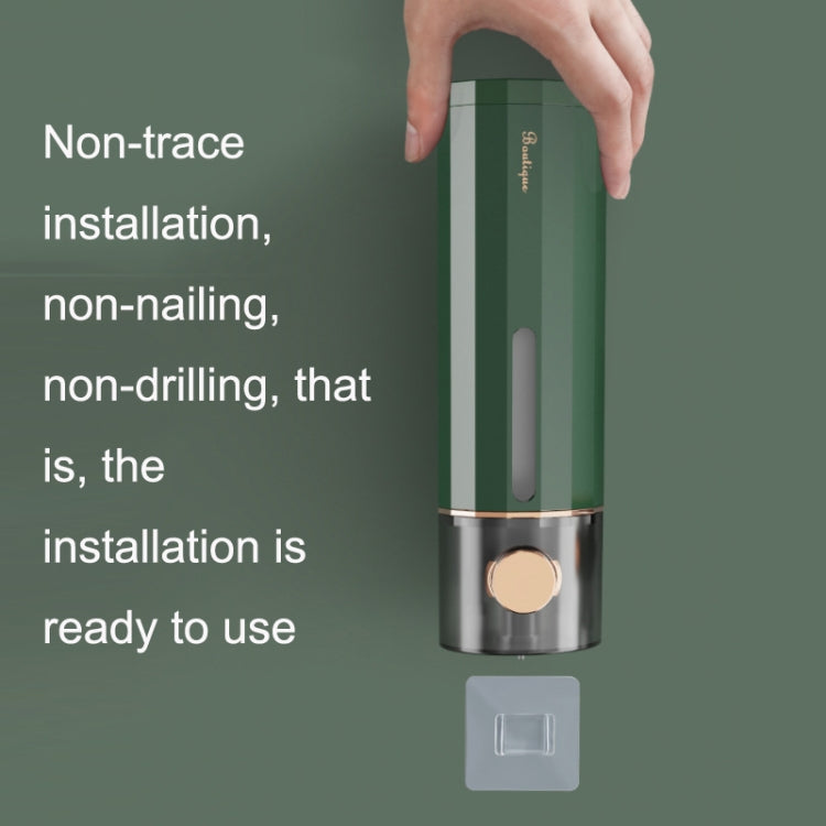 Wall-mounted dark green liquid soap dispenser with bracket mount piece for installation