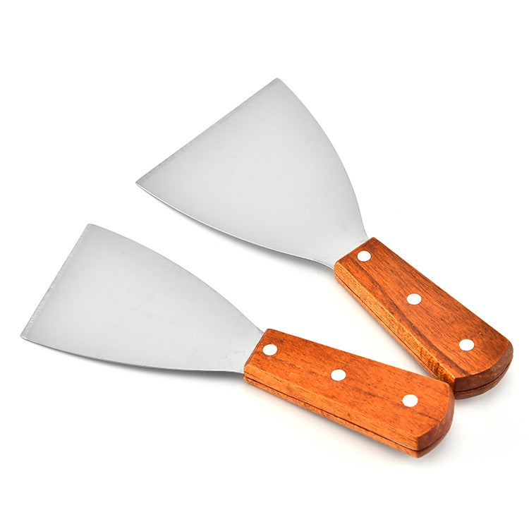 Two slanted stainless steel pizza and steak shovels with wooden handles.