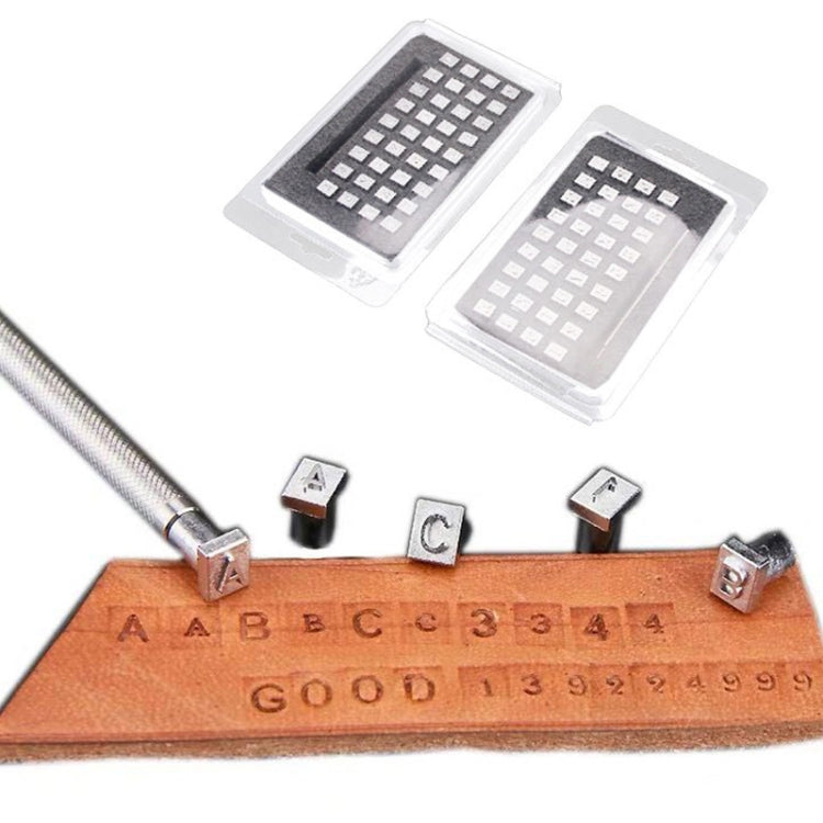 Leather letter stamping punch set with installed stamp heads and orange leather blank