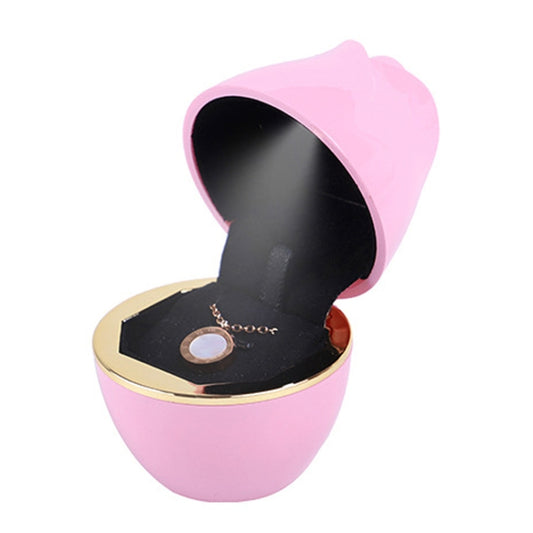 Pink rose-shaped jewelry storage box with open ring holder and necklace display