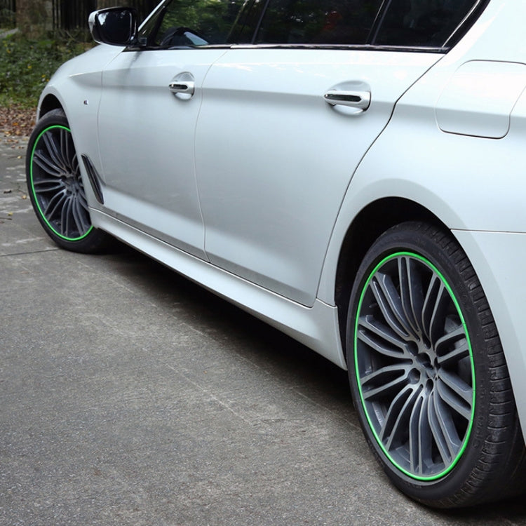 Car wheel protection ring on wheel rim, green edge trim around tire