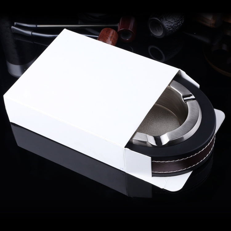 Black and silver metal cigar ashtray in a white gift-style box with cigar rest slots