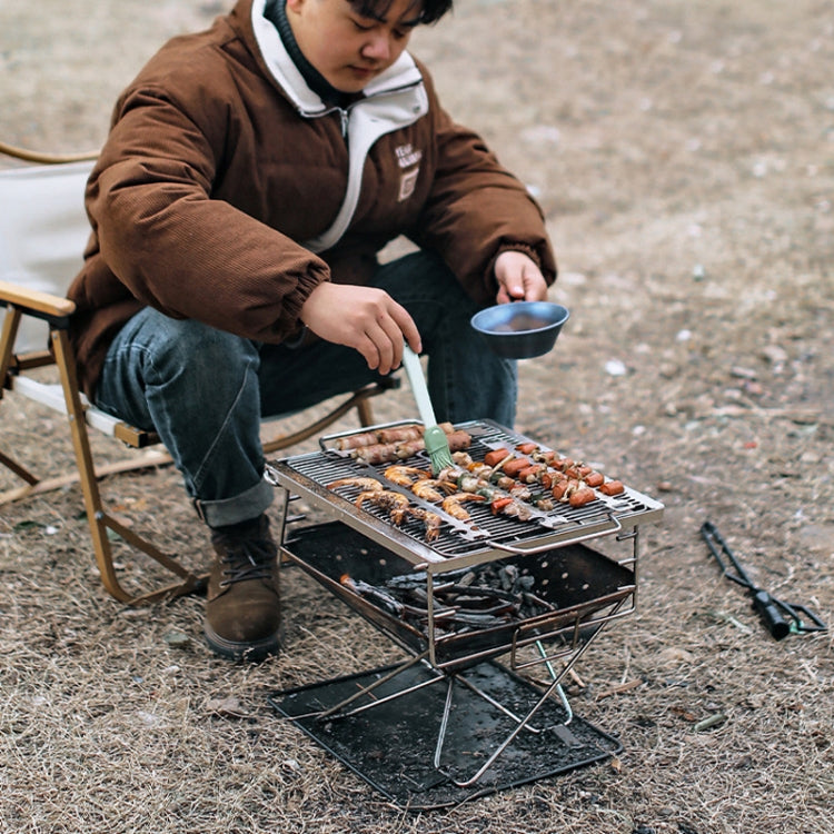 Outdoor grill with stainless fishbone skewers and assorted grilled meat cooking set