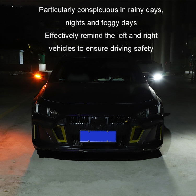 LED turn-signal streamer decoration on car front, glowing amber and white lights