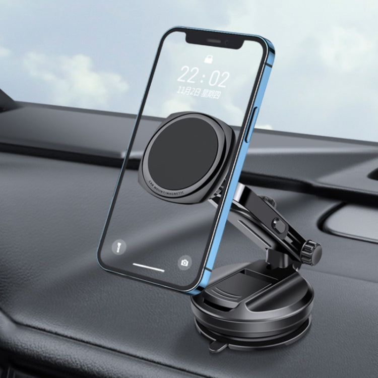 Magnetic car phone holder holding a smartphone on dashboard, black