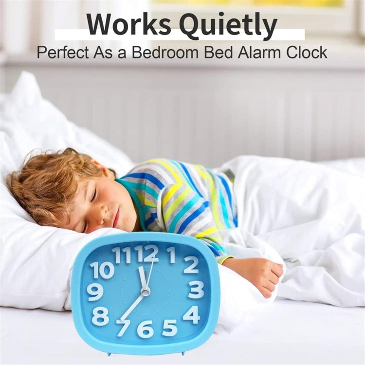 Blue square alarm clock on the bed beside a sleeping child, showing the time dial.