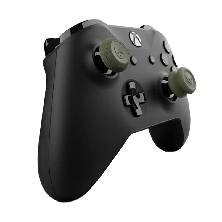 Gamepad with green rocker and thumbstick caps, grippy textured silicone pads