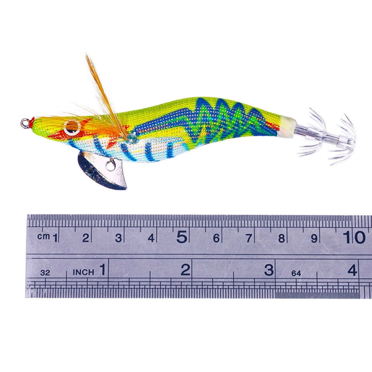 Yellow-green multi-color wooden shrimp lure next to a ruler for size reference