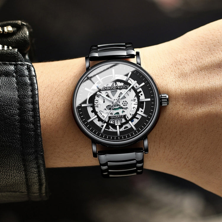 Black steel bracelet quartz skeleton watch on wrist with white dial and black bezel