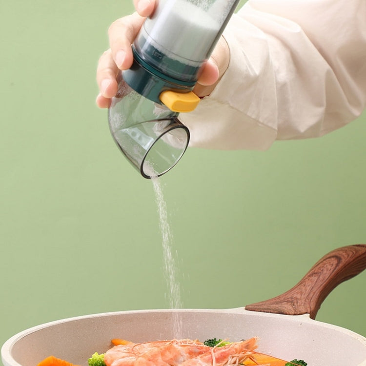 Quantitative seasoning jar pouring fine salt from the clear nozzle