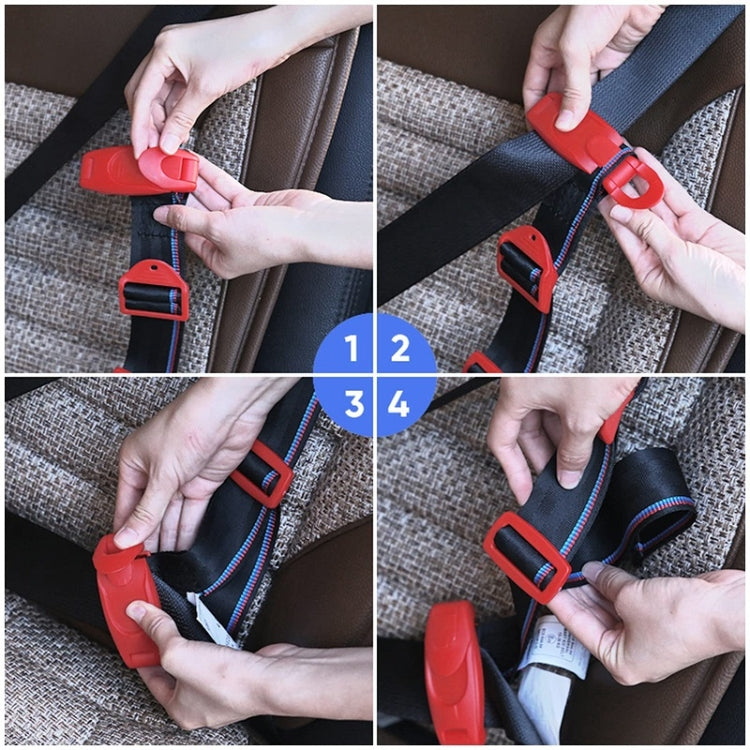 Hands installing a red car seat belt adjuster clip on a black webbing belt