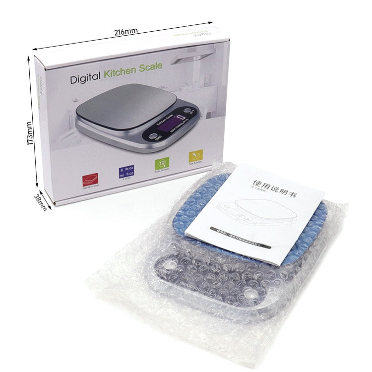 Digital kitchen scale in retail box, with LCD display and instruction booklet
