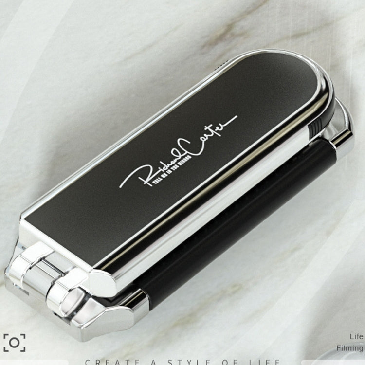 Integrated mirror panel on foldable hair comb with black grip and silver accents