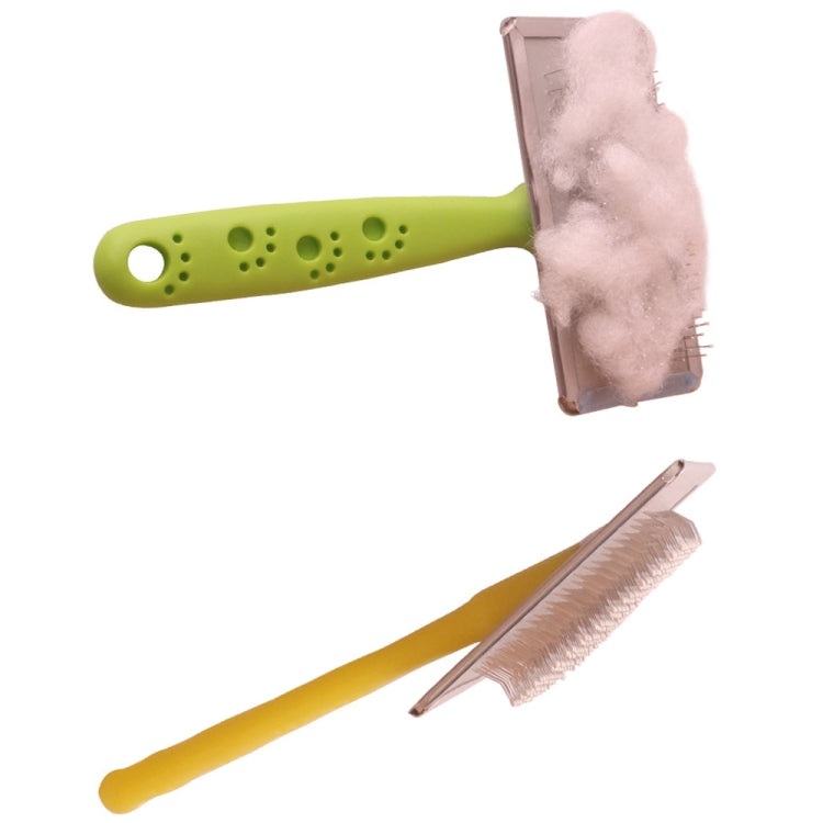 Pet hair removal comb with fur-catching pad bristles, green handle, pink head