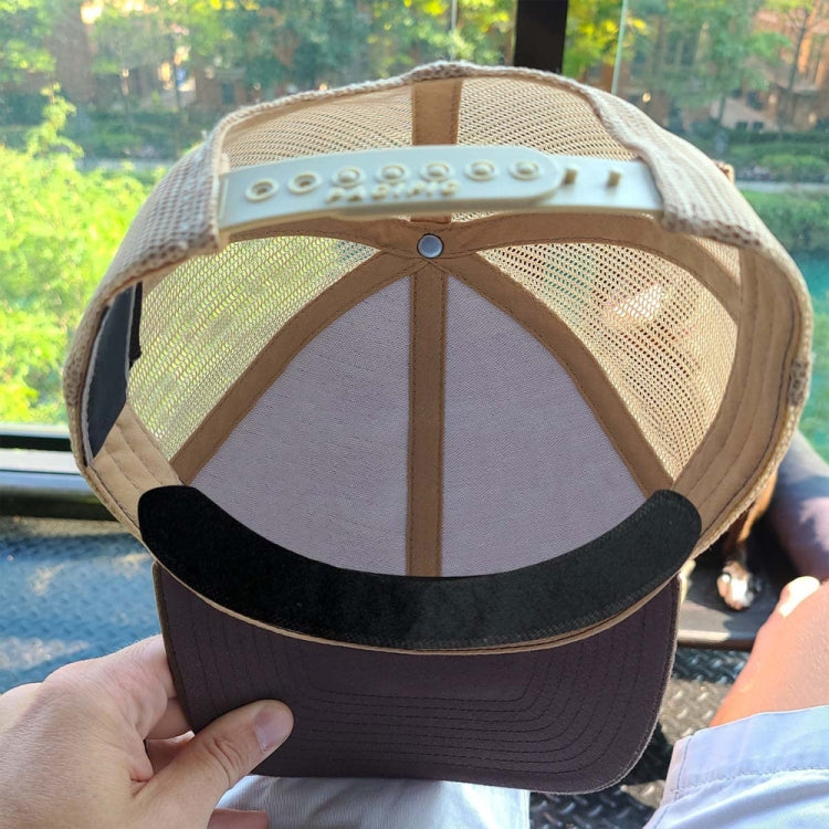 Cap with black sweat-absorbing sticker attached along the inner brim edge