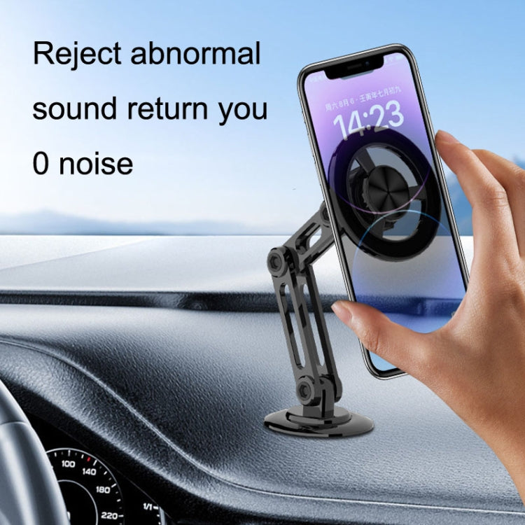 Black metal magnetic phone bracket with circular mount and adjustable stand; hand holding phone