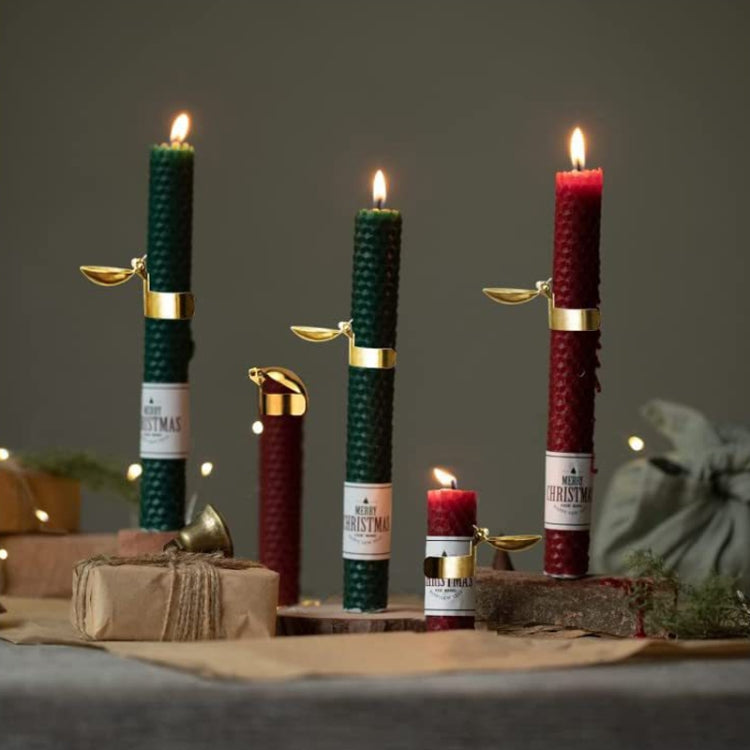 Gold automatic candle snuffer extinguisher clamps on festive lit candles
