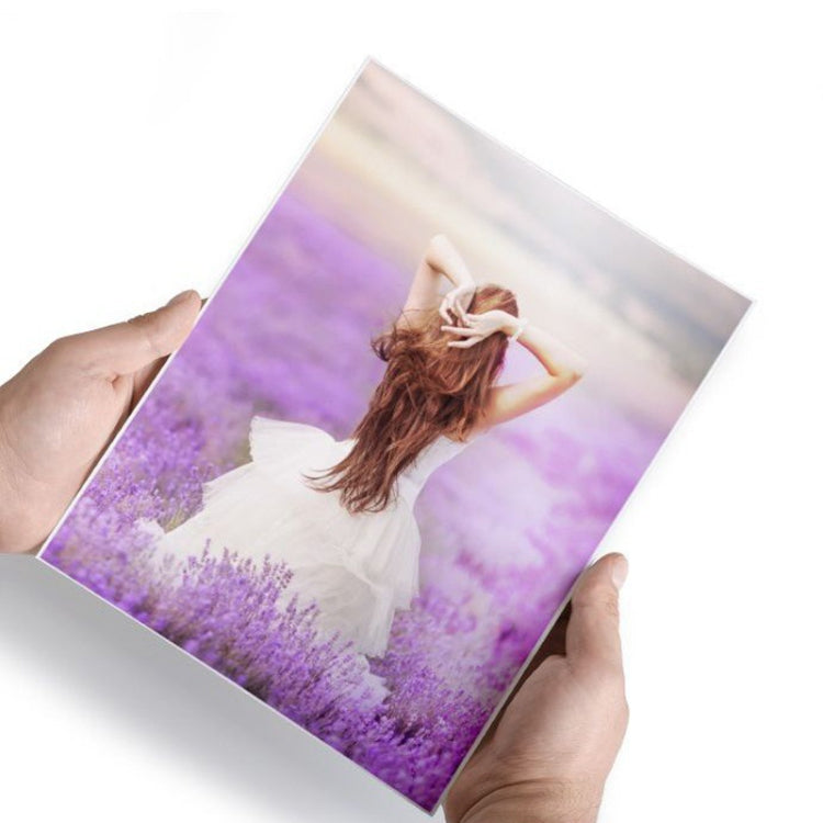 4R glossy photo paper sheet with printed portrait photo