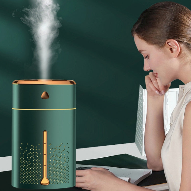 Mint green humidifier with glowing gold night light bar and rising mist column
