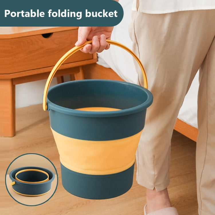 Portable folding bucket in deep blue with yellow band handle, for travel washing