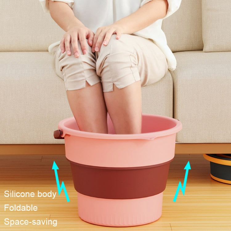 Large folding plastic bucket, pink with wide rim, silicone body for easy storage.